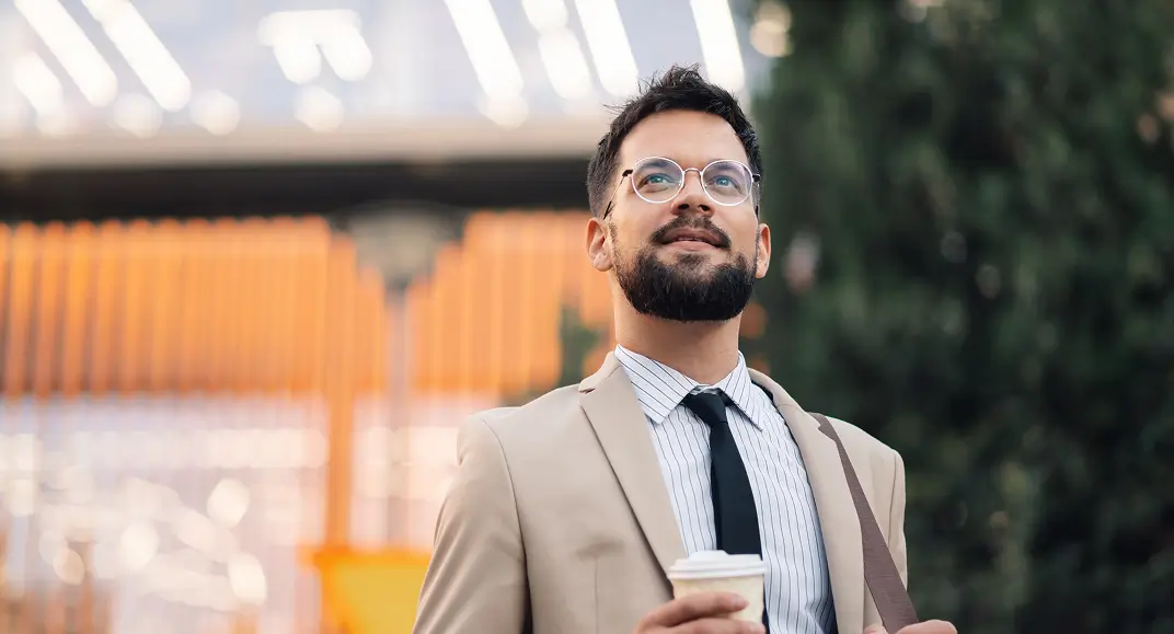 Financial professional smiling, representing the CoveredAdvisor Insurance Program